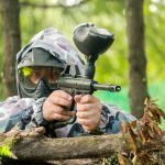 paintball player aiming at their next target