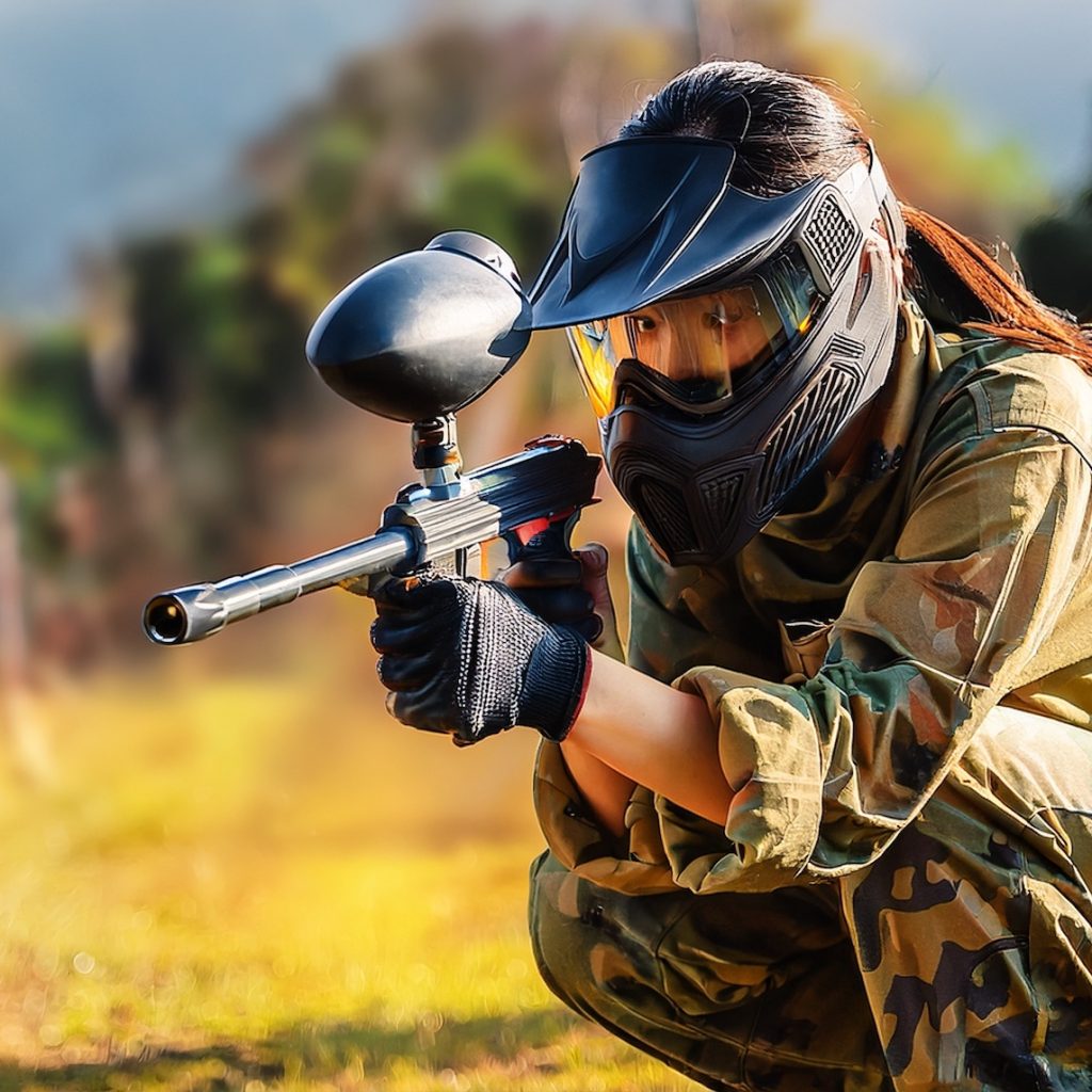 player playing with a paintball marker