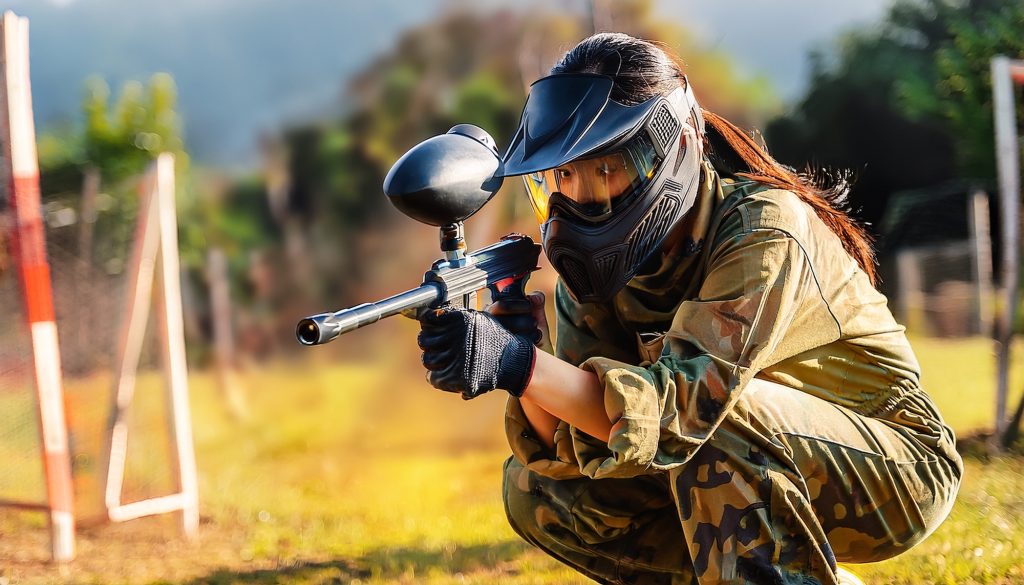 player playing with a paintball marker